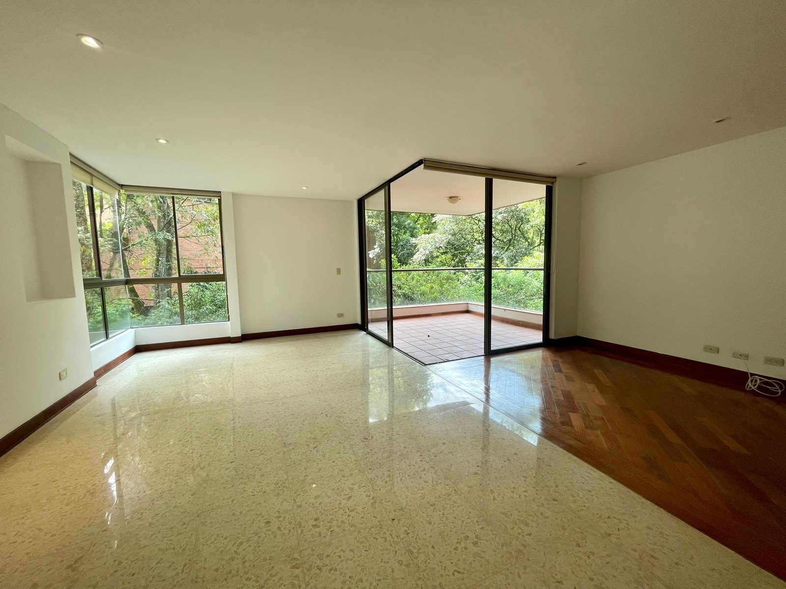 Quiet El Poblado Apartment with Large Balcony, Nice Hardwood Floors, Green Views and Two Pools