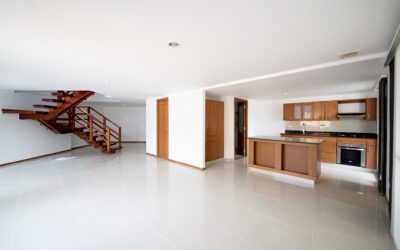 Spacious Two-Level Sabaneta Penthouse Complete With Two Balconies, Fireplace, and Amenities