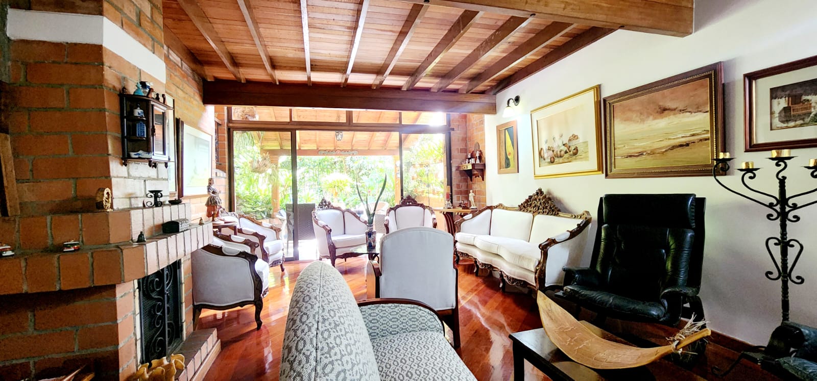 Spacious El Poblado Gated Community Home With High Ceilings, Classic Hardwood Flooring, And Soothing Outdoor Patio Space