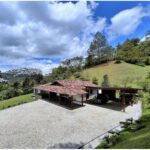 3BR El Retiro Gated Community Home – High Ceilings, Covered Porch Space, and Additional Caretaker’s House