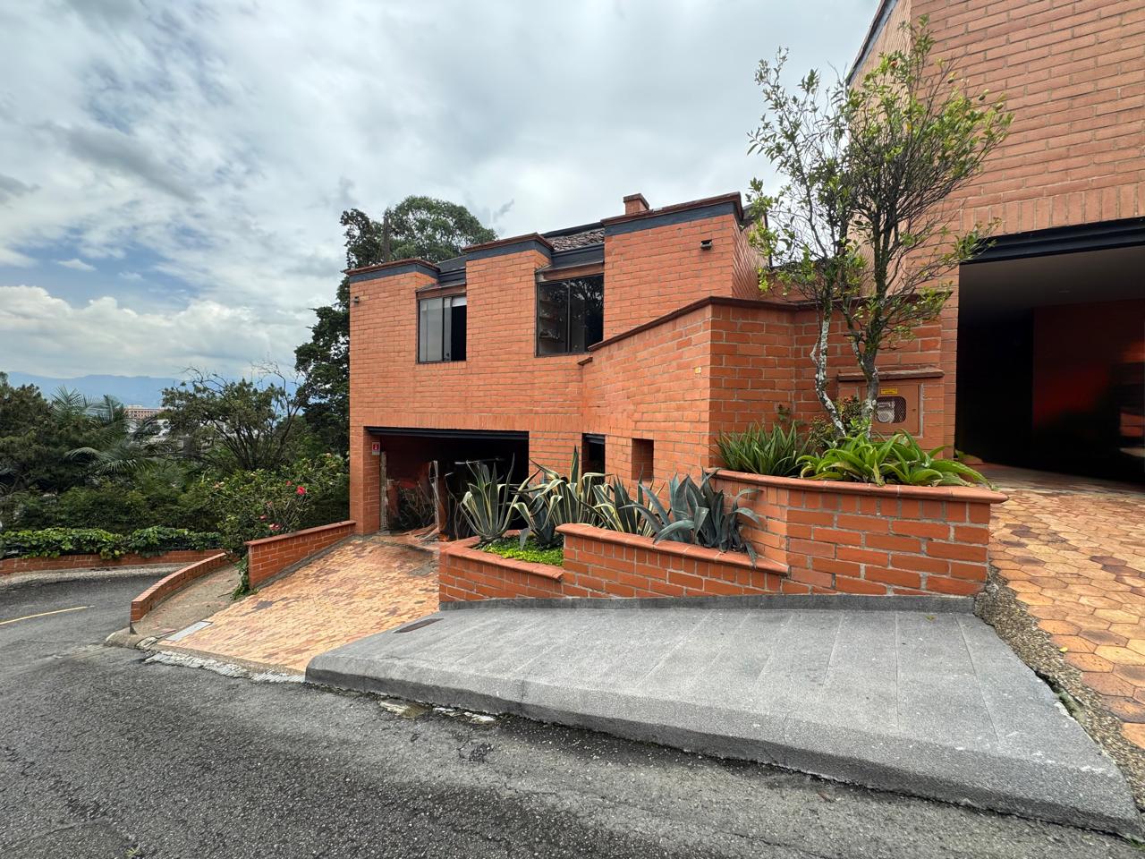 Exclusive Gated Community El Poblado Home With Remodeled Kitchen, High Ceilings, and Tranquil Backyard Space